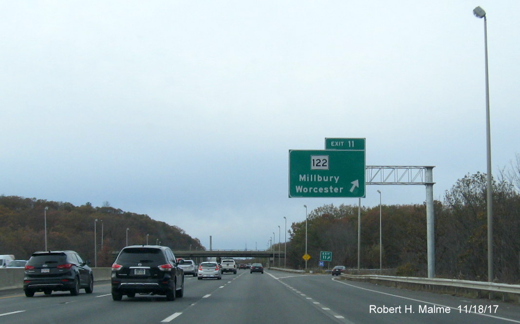 Image of newly placed overhead exit ramp sign for MA 122 exit on I-90 West in Millbury