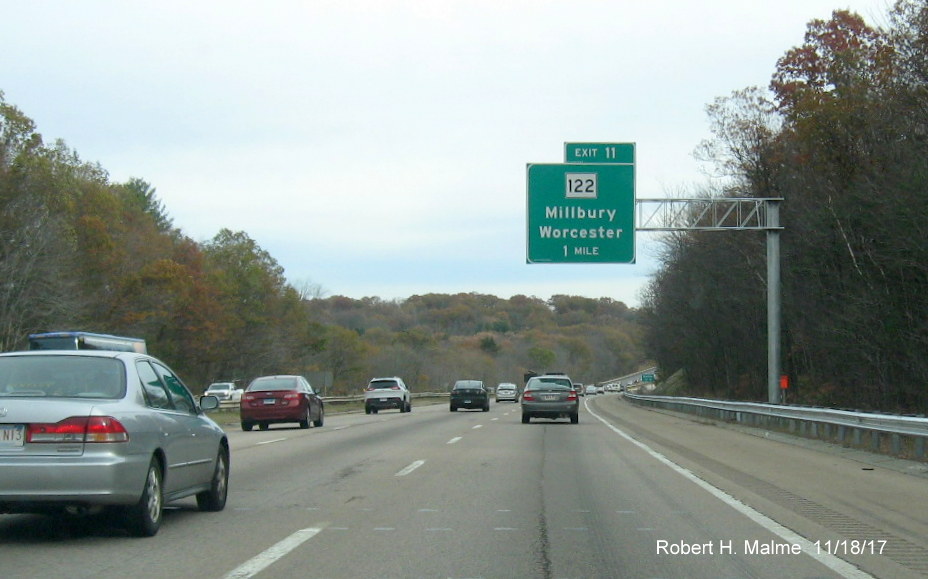Image of newly placed 1-mile advance overhead sign for MA 122 exit on I-90 East in Millbury