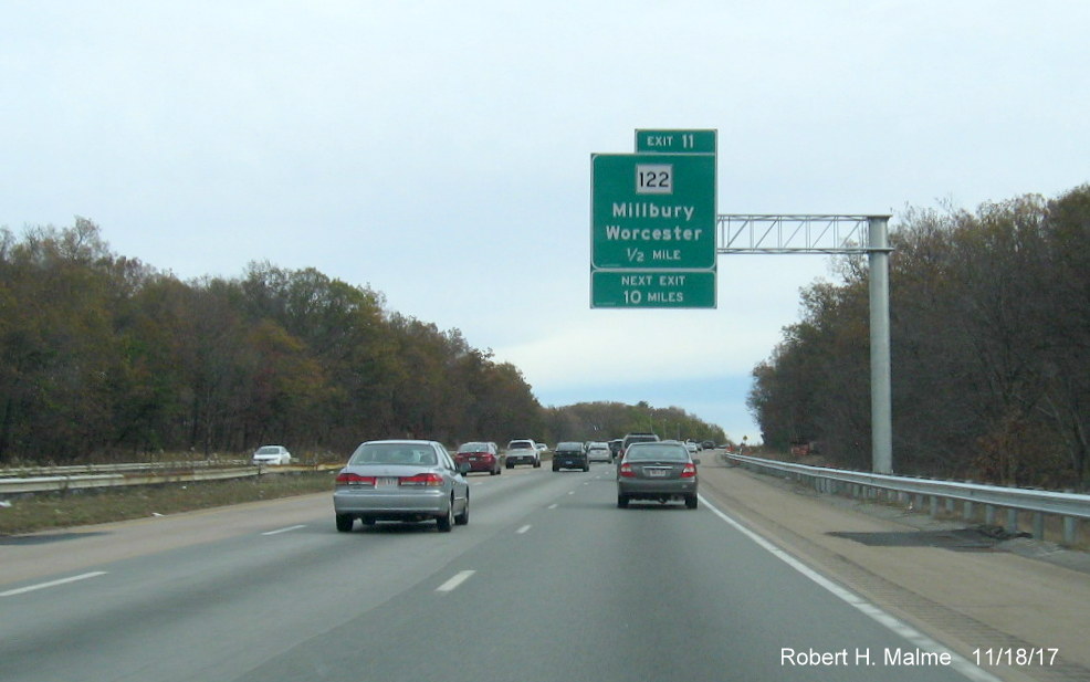 Image of newly placed 1/2 mile advance overhead sign for MA 122 exit on I-90 East in Millbury