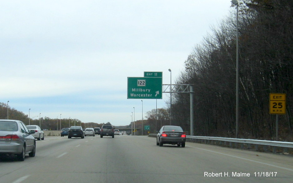 Image of newly placed overhead exit ramp sign for MA 122 exit on I-90 East in Millbury