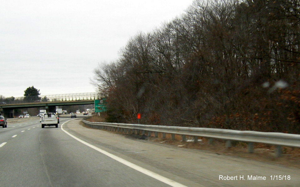 Image of newly placed foundation for future overhead 1/2 mile advance sign for MA 30 exit on I-90/Mass Pike West in Natick