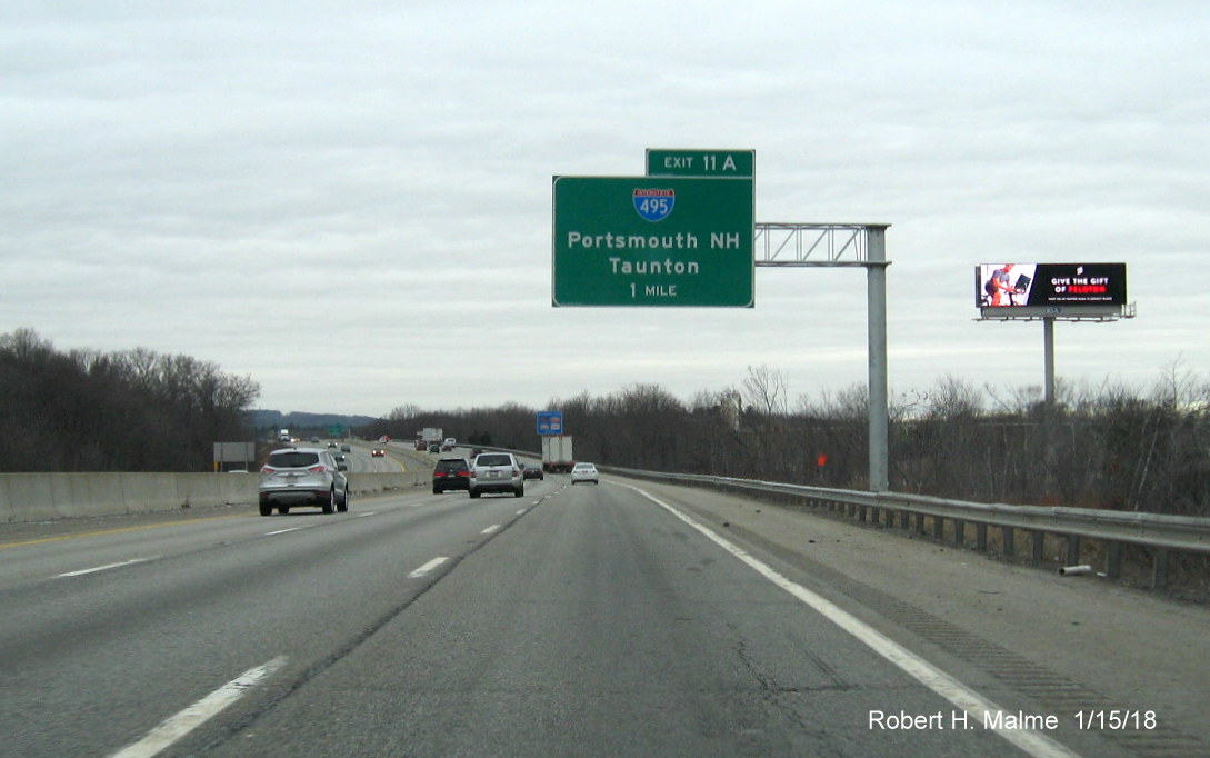 Image of recently placed 1-Mile advance overhead sign for I-495 exit on I-90/Mass Pike West in Westborough