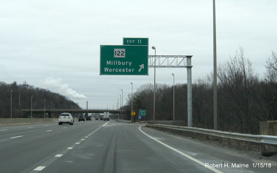 Image of recently placed overhead ramp sign for MA 122 exit on I-90/Mass Pike West in Millbury