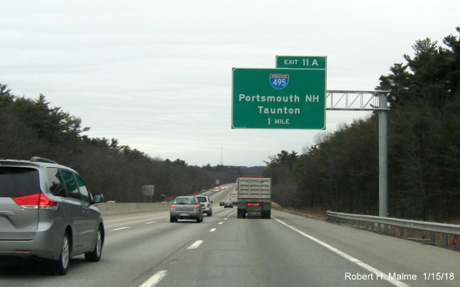 Image of newly placed 1-mile advance overhead sign for I-495 exit on I-90/Mass Pike East in Southborough