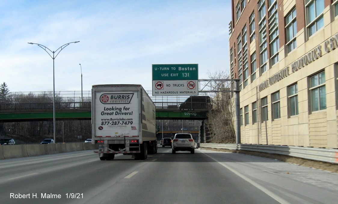 Image of overhead guide sign for U-Turn for Allston-Brighton-Cambridge exit with new milepost based exit number on I-90 West in Boston, January 2021