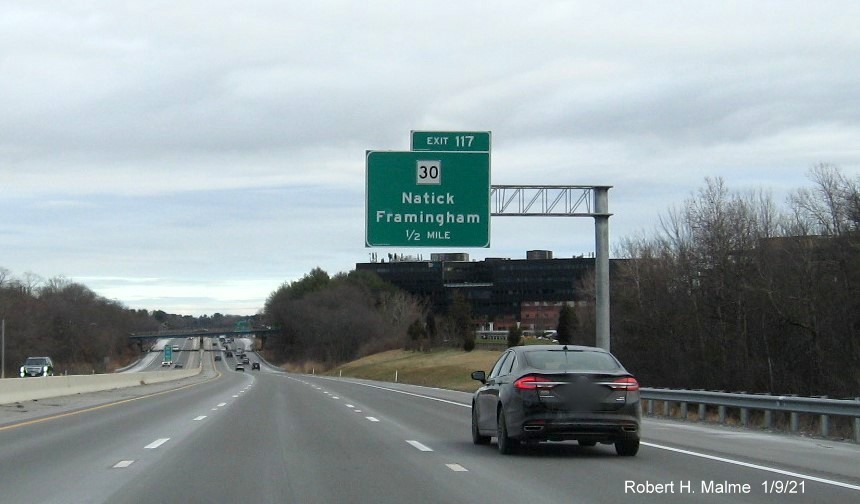 Image of 1/2 Mile advance overhead sign for the MA 30 exit with new milepost based exit number on I-90/Mass Pike East in Framingham, January 2021