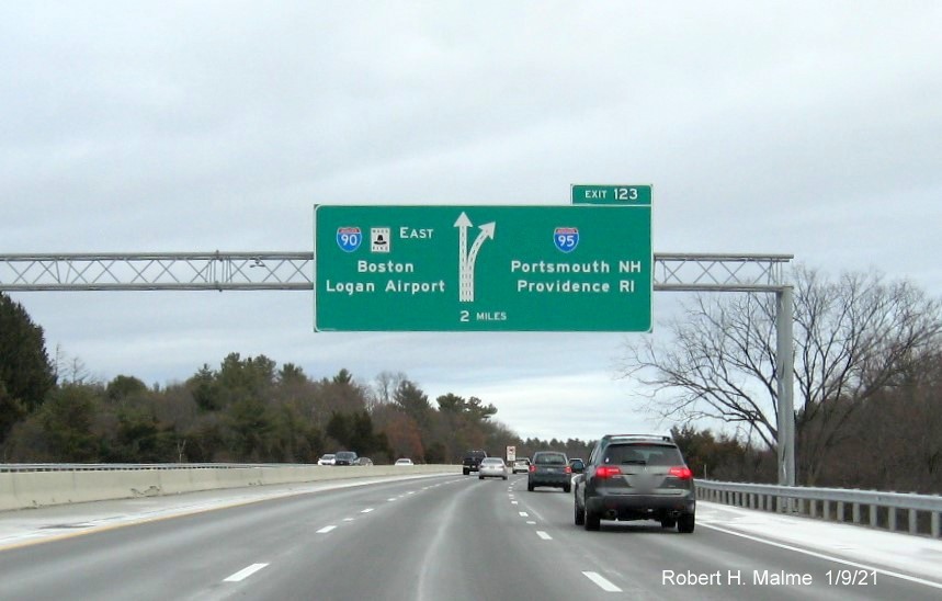 Image of 2-Miles advance overhead diagrammatic sign for I-95 exit with new milepost based exit number on I-90/Mass Pike East in Weston, January 2021