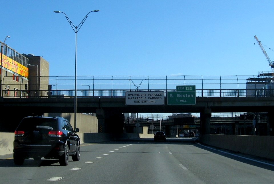 Image of 1-Mile advance overhead sign for South Boston exit with new milepost based exit number on I-90/Mass Pike East in Boston, January 2021