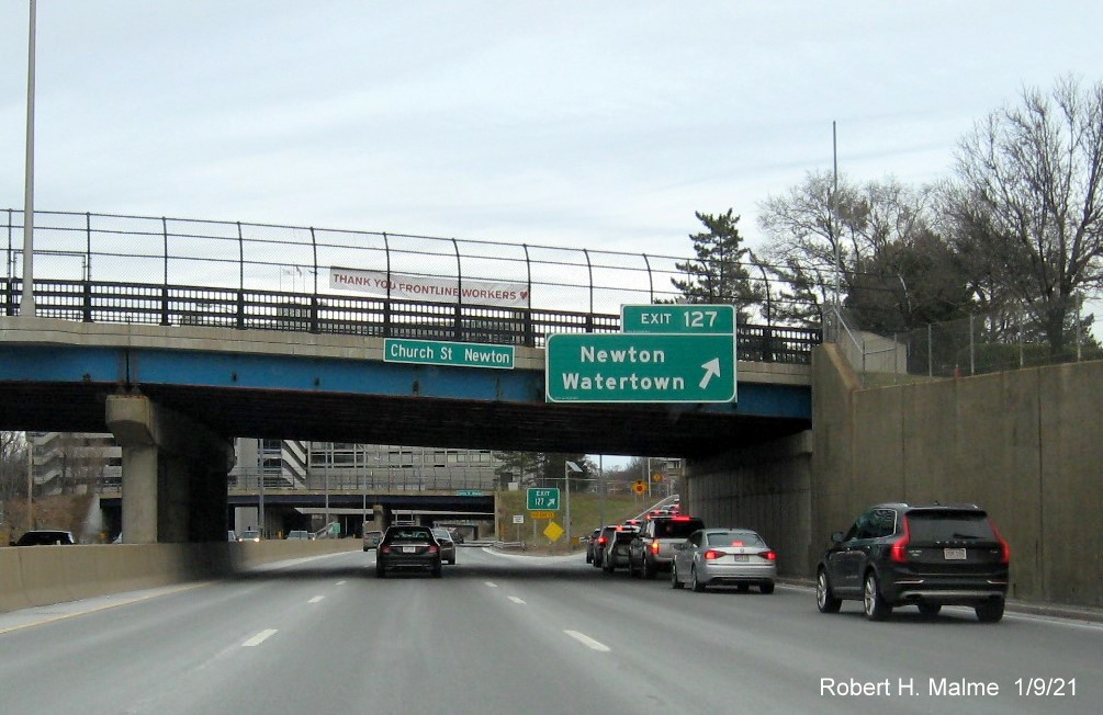 Image of overhead ramp sign for Newton/Watertown exit with new milepost based exit number on I-90/Mass Pike East in Newton, January 2021