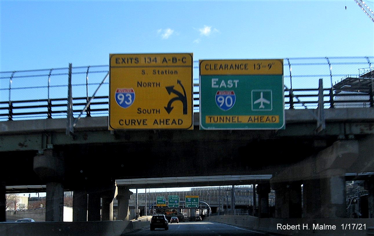 Image of yellow warning advance sign for I-93/South Station exits on I-90/Mass Pike East in Boston with unchanged exit number, January 2021