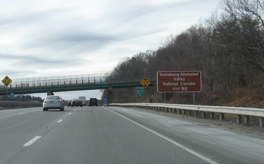 Image of brown cultural site auxiliary sign for I-290/I-395/MA 12 exit with new milepost based exit number on I-90/Mass Pike West in Auburn, by Vinh Lam, December 2020