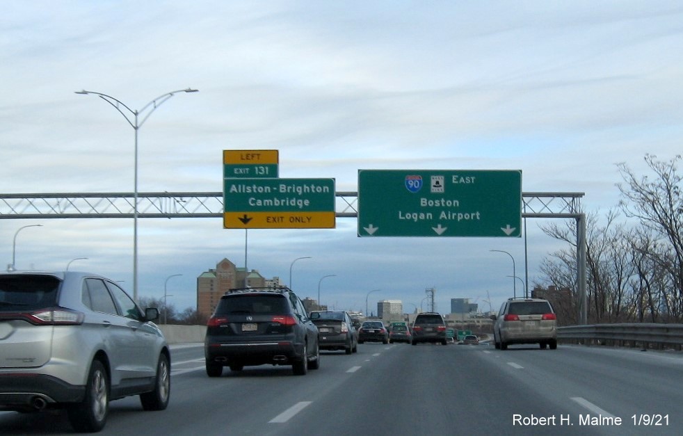 Image of overhead signs at ramp for Allston-Brighton-Cambridge exit with new milepost based exit number on I-90 East in Boston, January 2021