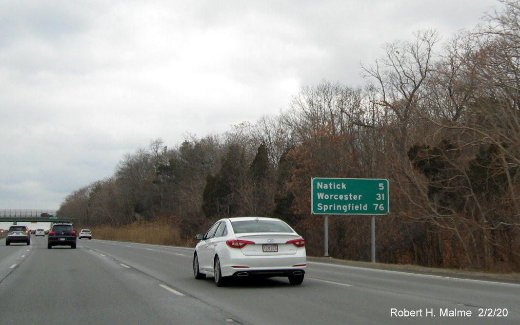 Image of existing post-interchange distance sign on I-90/Mass Pike West in Weston still awaiting replacement in Feb. 2020