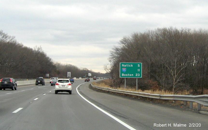 Image of recently placed post-interchange distance sign on I-90/Mass Pike East in Framingham, placement delayed due to bridge construction project