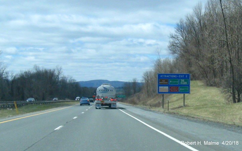 Image of blue services sign for US 20 exit on I-90/Mass Pike West in Lee