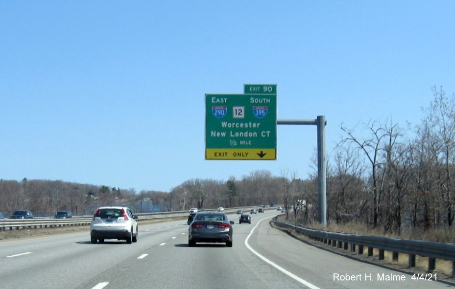 Image of 1/2 Mile advance overhead sign for I-290/I-395/MA 12 exit with new milepost based exit number 
                                             on I-90/Mass Pike East in Auburn, April 2021
