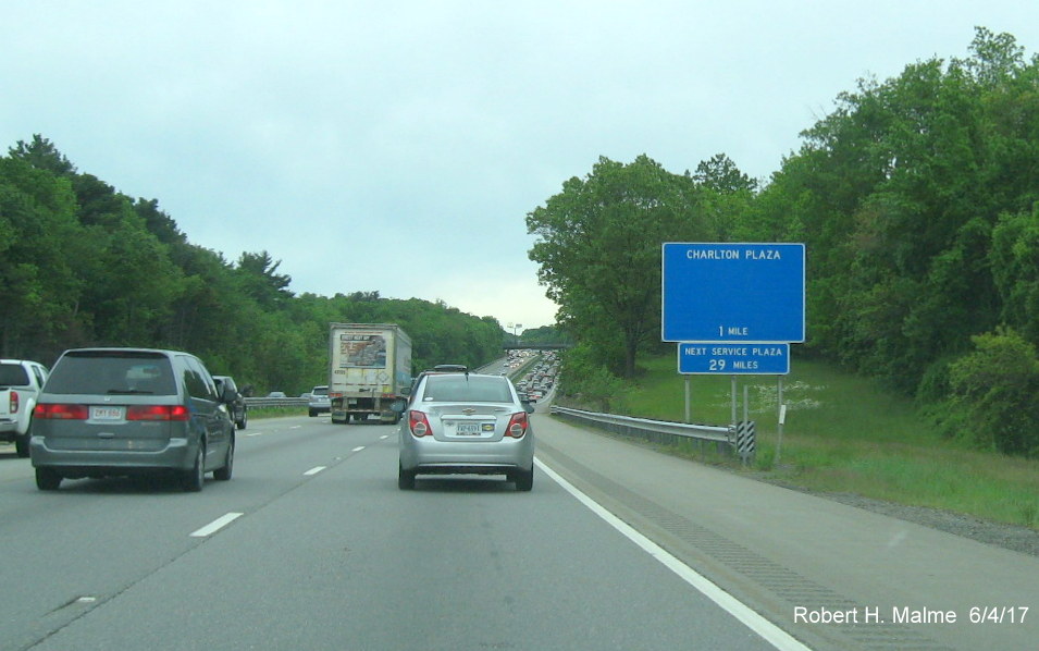 Image of newly placed, incomplete 1 mile advance sign for Charlton Service Plaza on I-90/Mass Pike West