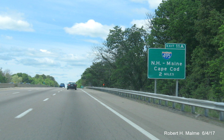 Image of contractor placed future overhead sign placement tag for 2-Mile exit sign for I-495 on I-90/Mass Pike West in Westborough