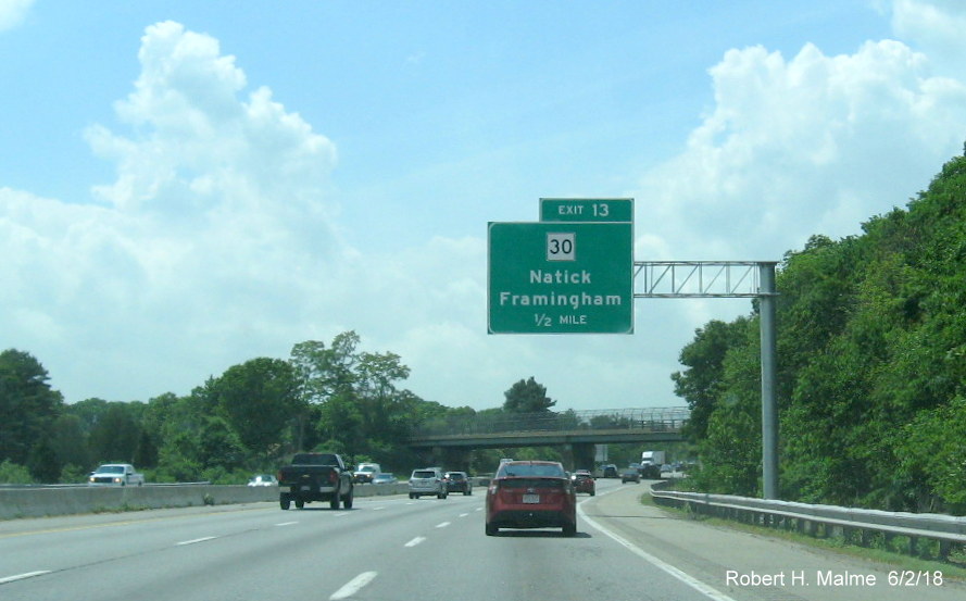 Image of newly placed 1/2 mile advance overhead sign for MA 30 exit on I-90/Mass Pike West in Natick