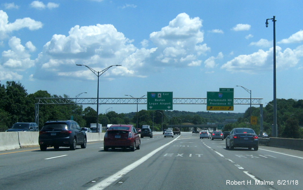 Image of newly placed overhead exit ramp and pull through signs at I-95 off-ramp from I-90/Mass Pike East in Weston
