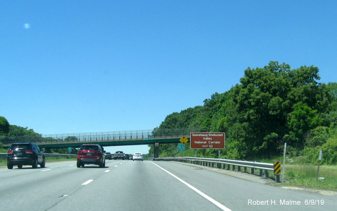 Image of brown historical attractions sign for I-290/I-395/MA 12 exit on I-90/Mass Pike West in Auburn
