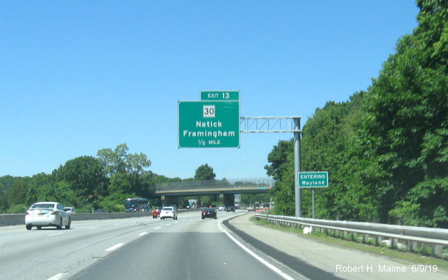 Image of recently installed ground mounted second Entering Wayland sign prior to MA 30 exit ib I-90/Mass Pike West