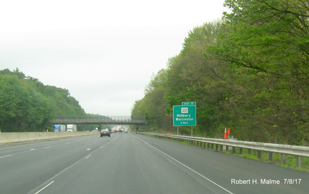 Image of contractor overhead sign support placement tag before MA 122 exit on I-90/Mass Pike in Millbury 