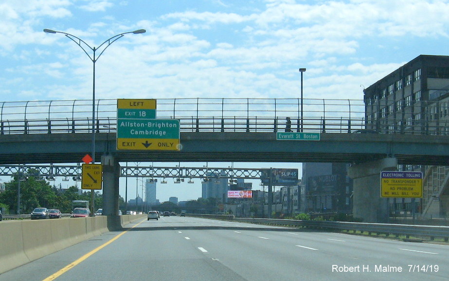 Image of newly placed bridge-mounted 1/2 mile advance sign for Allston-Brighton/Cambridge exit on I-90/Mass Pike East in Boston