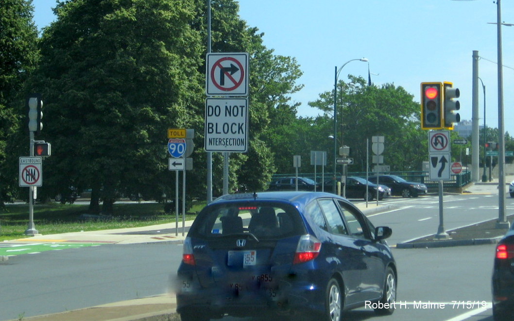 Image of recently placed Toll I-90 trailblazer with white arrow sign along Cambridge Street on ramp for Allston-Brighton/Cambridge exit