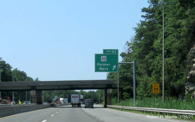 Image of overhead ramp sign for MA 32 exit with new milepost based exit number on I-90/Mass Pike West in Palmer, July 2021