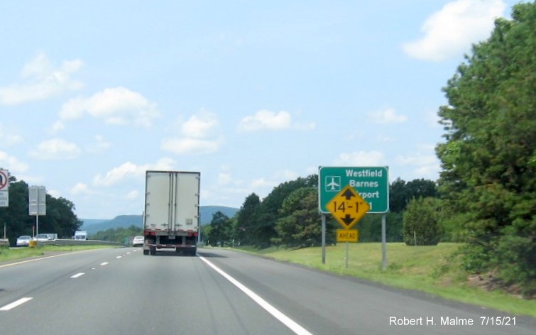 Image of green auxiliary overhead sign for US 202/MA 10 exit with new milepost based exit number on I-90/Mass Pike West in Westfield, July 2021