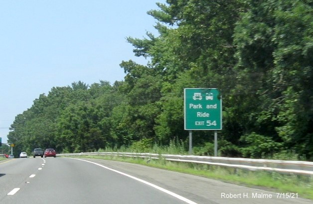 Image of auxiliary sign for MA 21 exit with new milepost based exit number on I-90/Mass Pike West in Ludlow, July 2021
