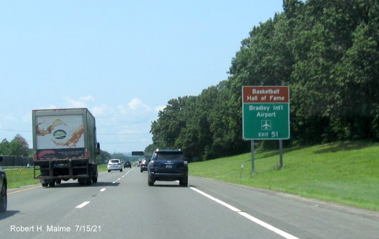Image of brown and green auxiliary sign for I-291 exit with new milepost based exit number on I-90/Mass Pike West in Chicopee, July 2021