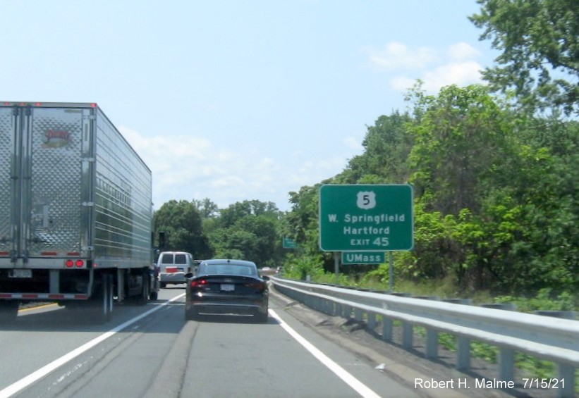 Image of auxiliary sign for I-91/US 5 exit with new milepost based exit number on I-90/Mass Pike West in Springfield, July 2021