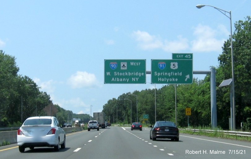 Image of overhead ramp sign for I-91/US 5 exit with new milepost based exit number on I-90/Mass Pike West in West Springfield, July 2021