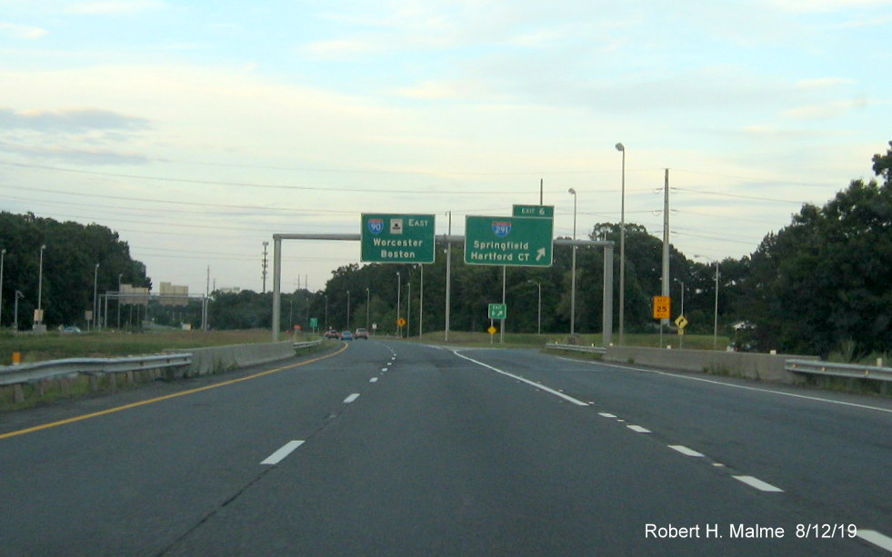 Image of overhead exit and pull through signage at ramp to I-291 West on I-90/Mass Pike East in Chicopee in Aug. 2019