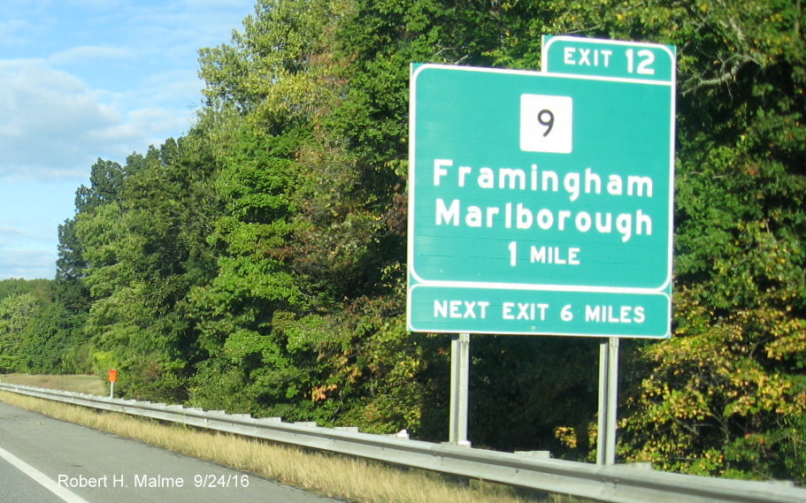 Image of new orange tab sign marking the site ofa future overhead sign on I-90/Mass Pike West in Framingham