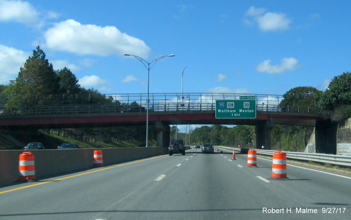 Image of 1-Mile bridge mounted exit sign for I-95 with new exit tabs on I-90 West in Newton