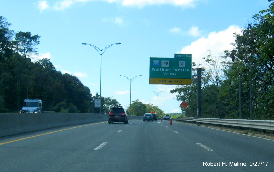 Image of overhead exit sign for I-95/MA 30 exit on I-90 West in Weston with new exit tab