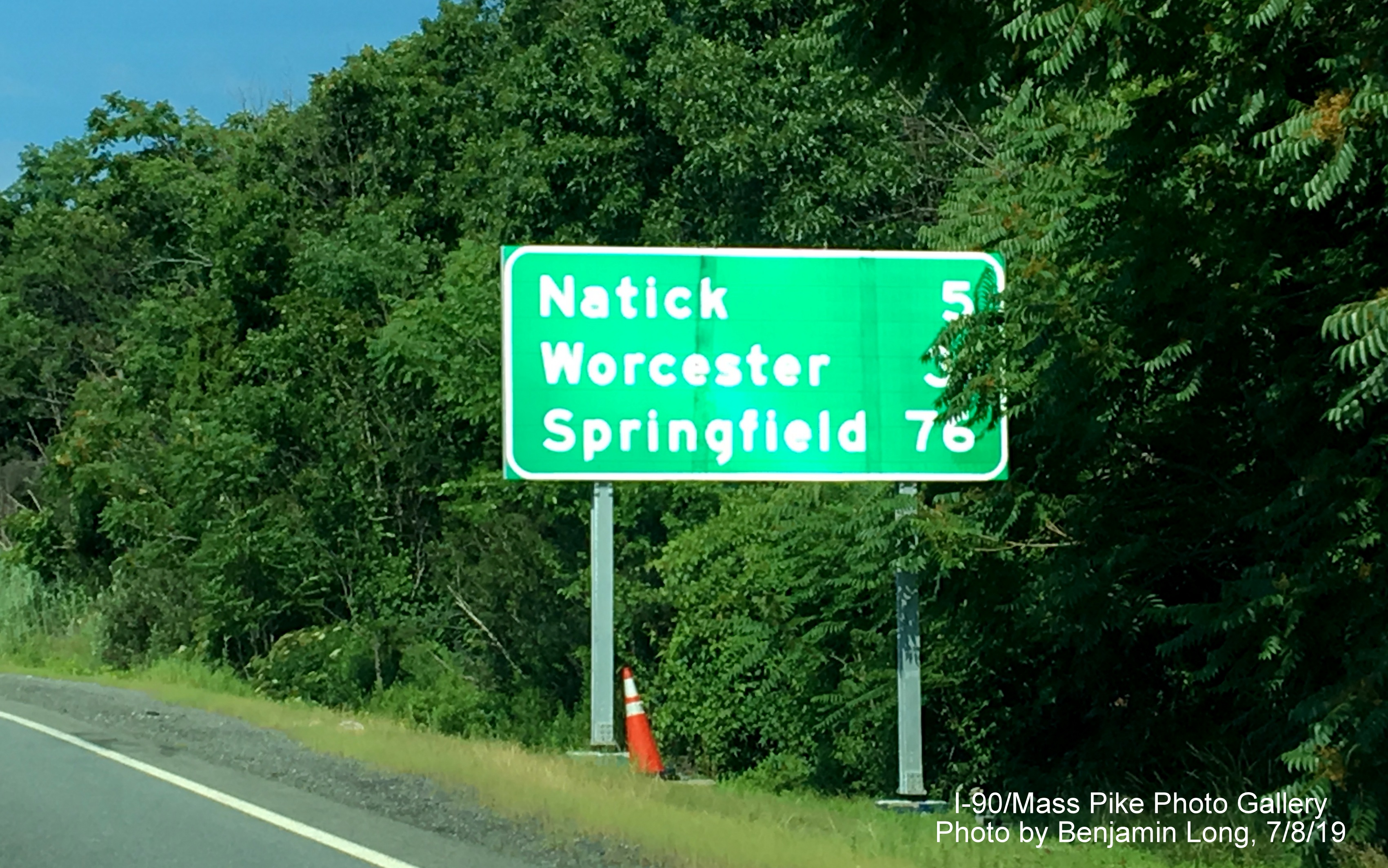 Image of recently placed post-interchange distance sign on I-90/Mass Pike West in Weston, by Benjamin Long