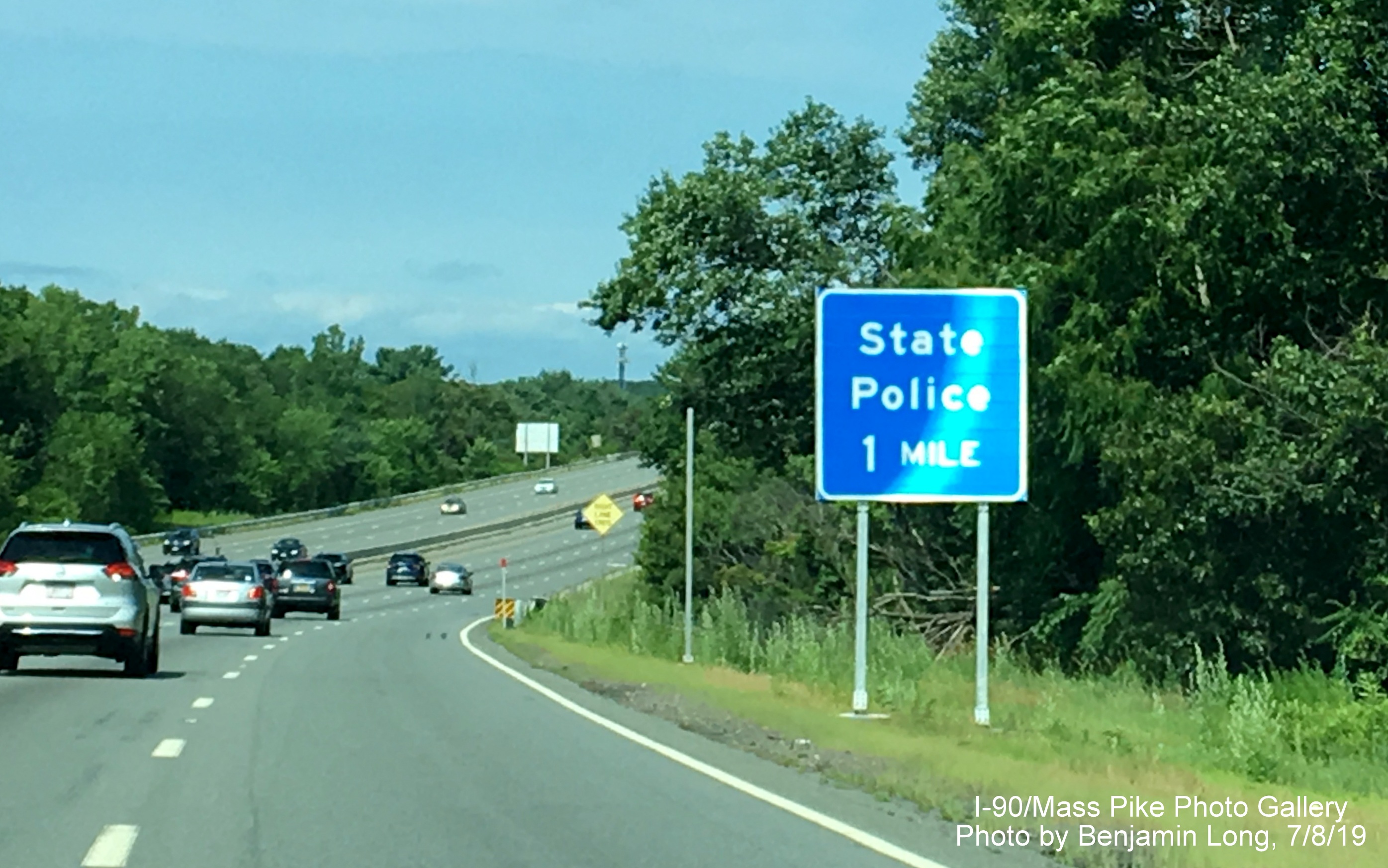 Image of recently placed blue 1-mile sign for State Police Barracks on I-90/Mass 
                                                   Pike West in Weston, by Benjamin Long