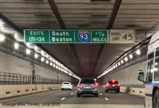 Image of 1 1/2 mile advance sign for I-93/South Station exits on I-90/Mass Pike 
		East in Boston with milepost exit numbers, January 2021