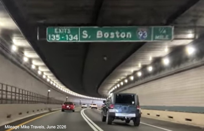 Image of 1 1/2 mile advance sign for I-93/South Station exits on I-90/Mass Pike 
		East in Boston with milepost exit numbers, January 2021