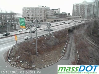 Image of MassDOT traffic camera looking west at I-90/Mass Pike near Commonwealth Avenue bridge showing no exit tab on overhead sign for Allston-Brighton-Cambridge exit, December 2020