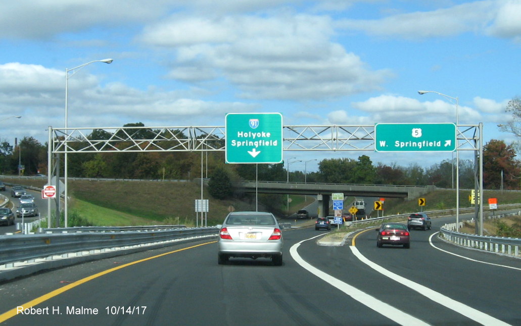 Image of signage through site of former toll plaza on ramp from I-90/Mass Pike to I-91/US 5 in West Springfield