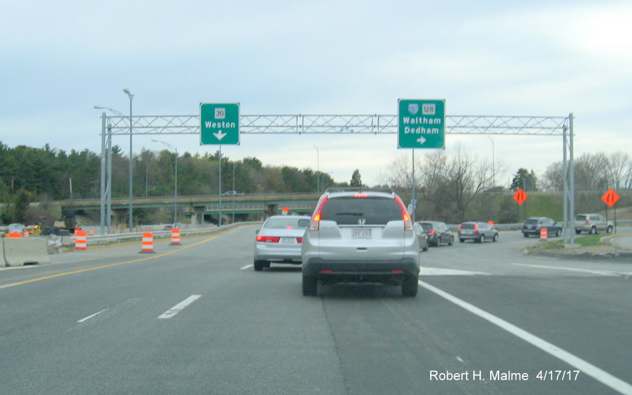 Image of overhead signs shortly to be removed at I-90/Mass Pike west former Weston toll plaza interchange
