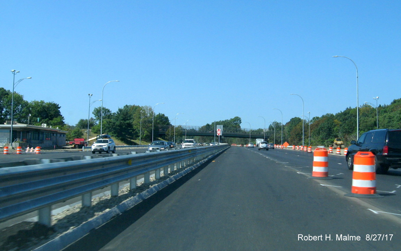 Image of view of newly paved lanes through former toll booth area on ramp from I-95 North to I-90/Mass Pike West