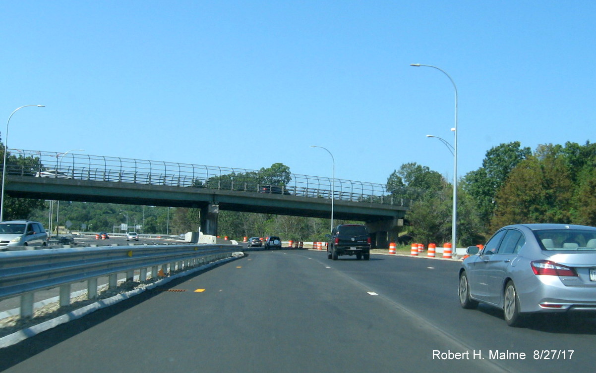 Image taken of newly paved lanes at merge of traffic from I-95 South and North on ramp to I-90/Mass Pike West in Weston