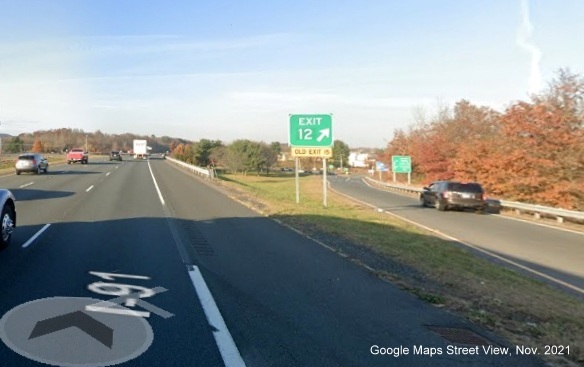 Image of gore sign for Lower Westfield Road with new milepost based exit number and yellow Old Exit 15 sign attached below on I-91 North in Holyoke, Google Maps Street View image, November 2021