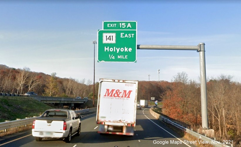 Image of 1/4 mile advance overhead sign for MA 141 East exit with new milepost based exit number on I-91 North in Holyoke, Google Maps Street View image, November 2021